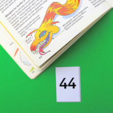 finding a numbered page in a book family maths game