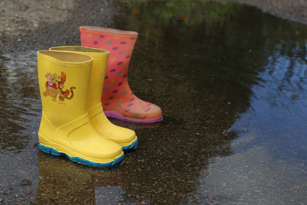 three wellington boots, one pair and one odd boot