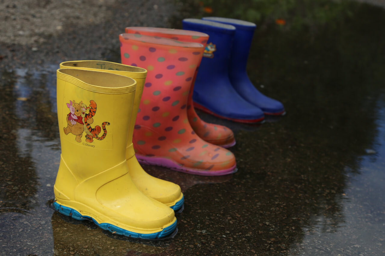 six wellington boots, three pairs